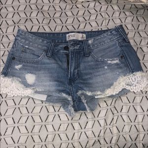 Lace detailed denim shorts
